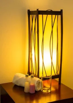 Lamp on a night table. Stock Photos