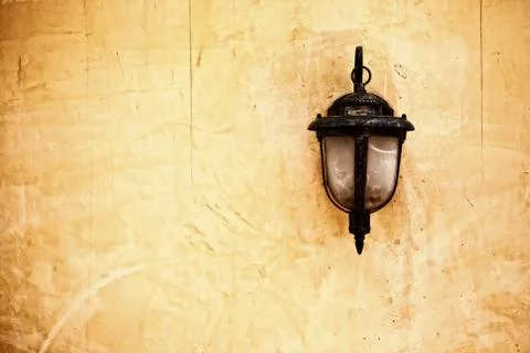Lamp on old wall Stock Photos