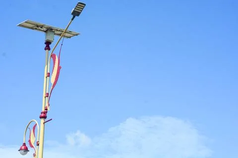 Lamp post against clear sky background Stock Photos