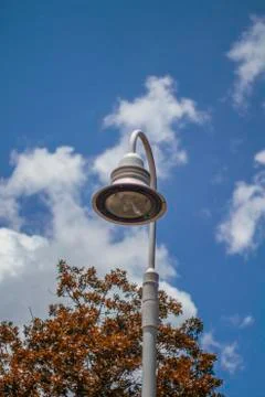 Lamp Post Against a Light Blue Sky Stock Photos