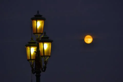 Lamp Post and Full Moon Stock Photos