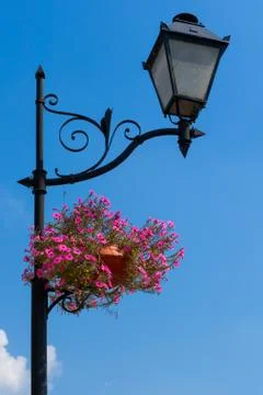 Lamp post with flower pots Stock Photos