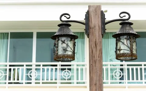 Lamp post in front of the balcony Stock Photos