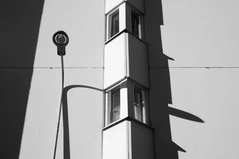 Lamp post leaning into a building Stock Photos