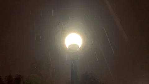 Lamp Post at Night Under Rain Stock Footage 140215095