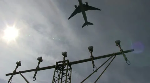 Lamp post, plane taking off Stock Footage