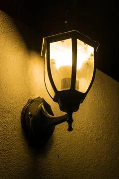 Lamp post at wall Stock Photos