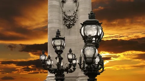 Lamp posts on Alexander III Bridge against the sunset (with zoom). Paris, France Stock Footage 265842942