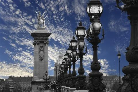Lamp posts on Alexander III Bridge against the sky with clouds. Paris, France Foto stock