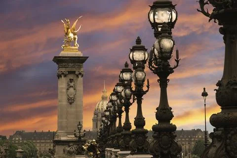 Lamp posts on Alexander III Bridge against the sky at sunset. Paris, France 写真素材