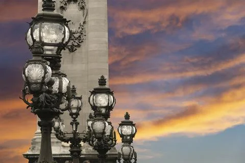 Lamp posts on Alexander III Bridge against the sky at sunset. Paris, France 写真素材