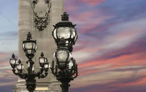 Lamp posts on Alexander III Bridge against the sky at sunset. Paris, France 写真素材
