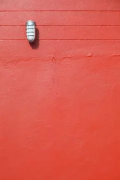Lamp on the red wall 库存照片