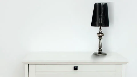 The lamp slides across the table Stock Footage 201366070