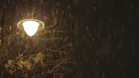 Lamp in the snowstorm at night Video stock 44514152