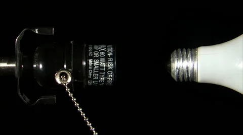 Lamp socket with detached bulb and swinging pull string. Stock Footage 52326425