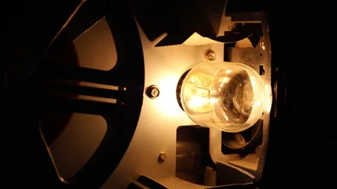Lamp Of Super 8MM Projector With Spinning Film Reel Stock Footage 337143386