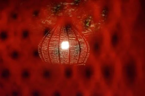 Lamp through the red grids Stock-Fotos