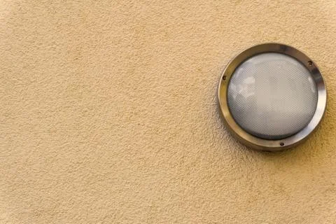 A lamp on a wall Stock Photos