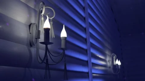 Lamp on the wall.lamp in the shape of a candle on the wall.lamp on the wall Stock Footage 247153513