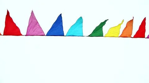 A lamppost and colorful triangular flags fluttering in the wind against an ov Stock Photos