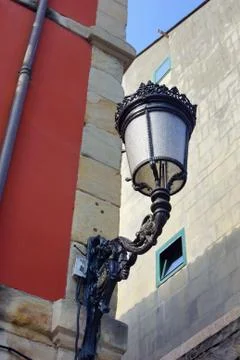 Lamppost and red  wall Stock Photos