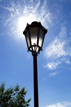 Lamppost on the blue sky Stock Photos