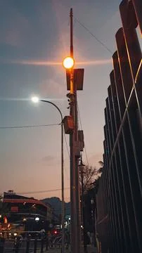 A lamppost with a burning lamp Stock Photos