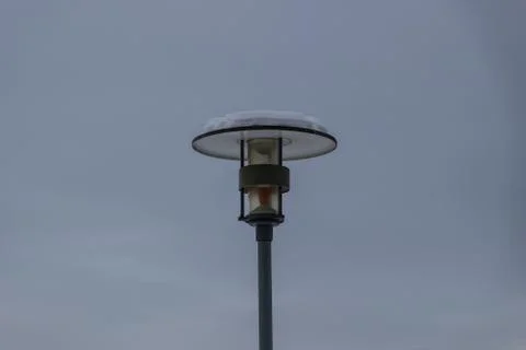 Lamppost on the gray sky background Foto stock