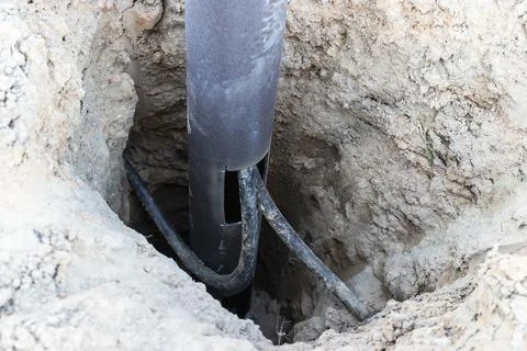 Lamppost with open hole. Inside is a power switch and electrical cables. Foto stock
