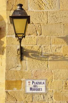Lamppost in a orange wall Stock Photos