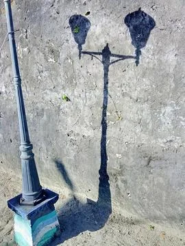 Lamppost. The shadow of a lamppost on the wall. Stock Photos