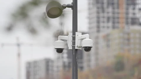 Lamppost stands in front of high-rise under construction Stock Footage 309754349