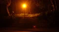 Lamppost by the street filmed by night, very yellow glow HD Footage