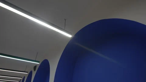 Lamps in form of tubes mounted under ceiling in hotel lobby 動画素材 283367302