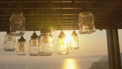 Lamps hanging from the ceiling at sunset 動画素材 141679715