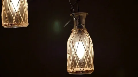 Lamps in the shape of the bottles sway on the background of smoke 動画素材 71186399