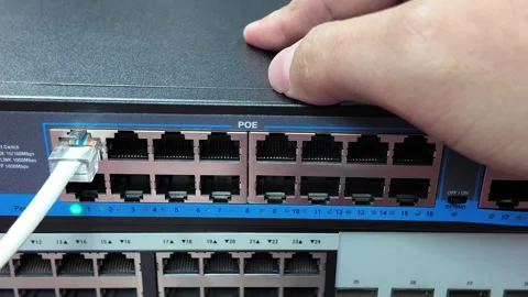 LAN cable clamp for inserting into the switch slot. Stock Footage 330274265