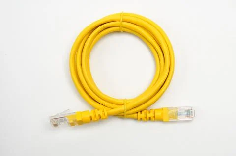 LAN cable with RJ45 plug on a white background Stock Photos