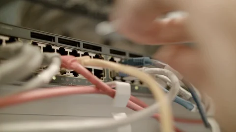 Lan cables coming out of a switch Stock Footage 85503711