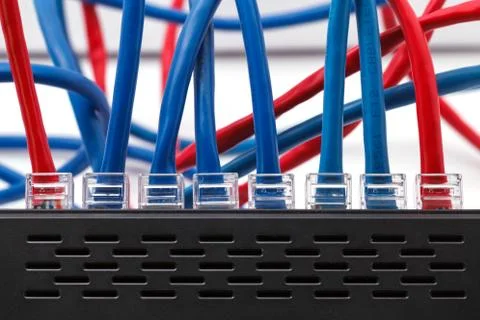 LAN network switch with ethernet cables plugged in Foto stock