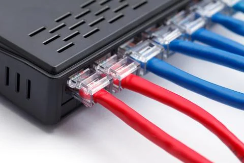 LAN network switch with ethernet cables plugged in Stock Photos