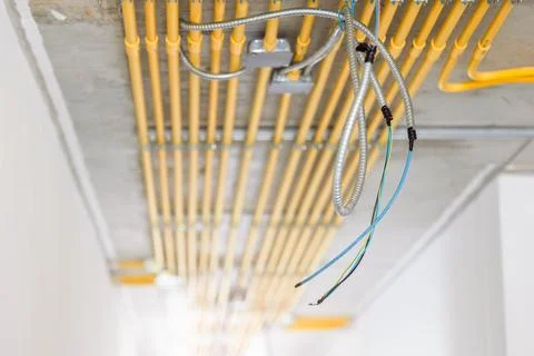 LAN network wire install in construction building with metal steel flexible.. Stock Photos