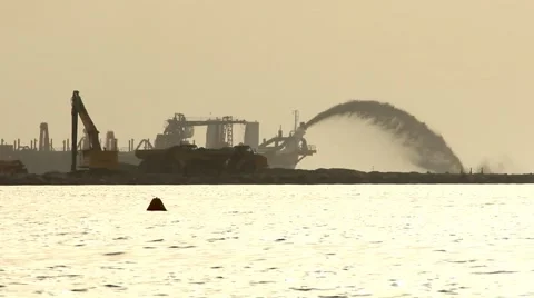 Land reclamation, trailing suction hopper dredger stream silhouette Stock-Footage 60129604