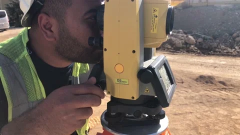 Land surveyor does measures on geodetic total station Stock Footage 150348428