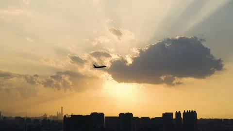 Land take off flight fly plane landmark flare golden cinematic scenic ray Stock Footage 233576140