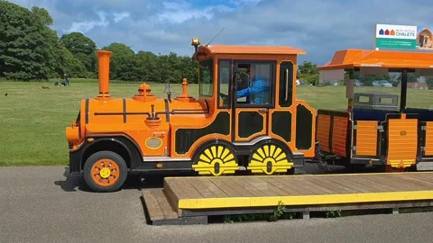 Land train pulling away from the platform Stock-Footage 202937621