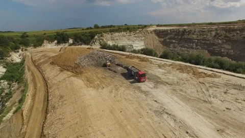 A landfill lorry is preparing for unloading garbage in junkyard. Aerial shot. Stock Footage 94740152