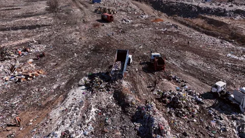 Landfill with solid household waste. Garbage truck unloads rubbish Stock Footage 211445651