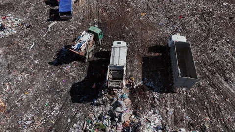 Landfill with solid household waste. Garbage truck unloads rubbish Stock Footage 211451580